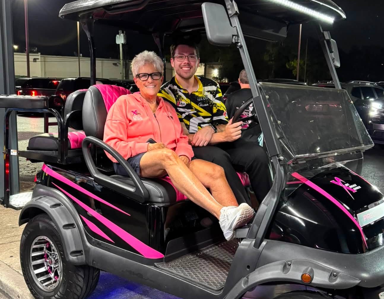 Donna Conners with golf cart winner Brandon Bonta